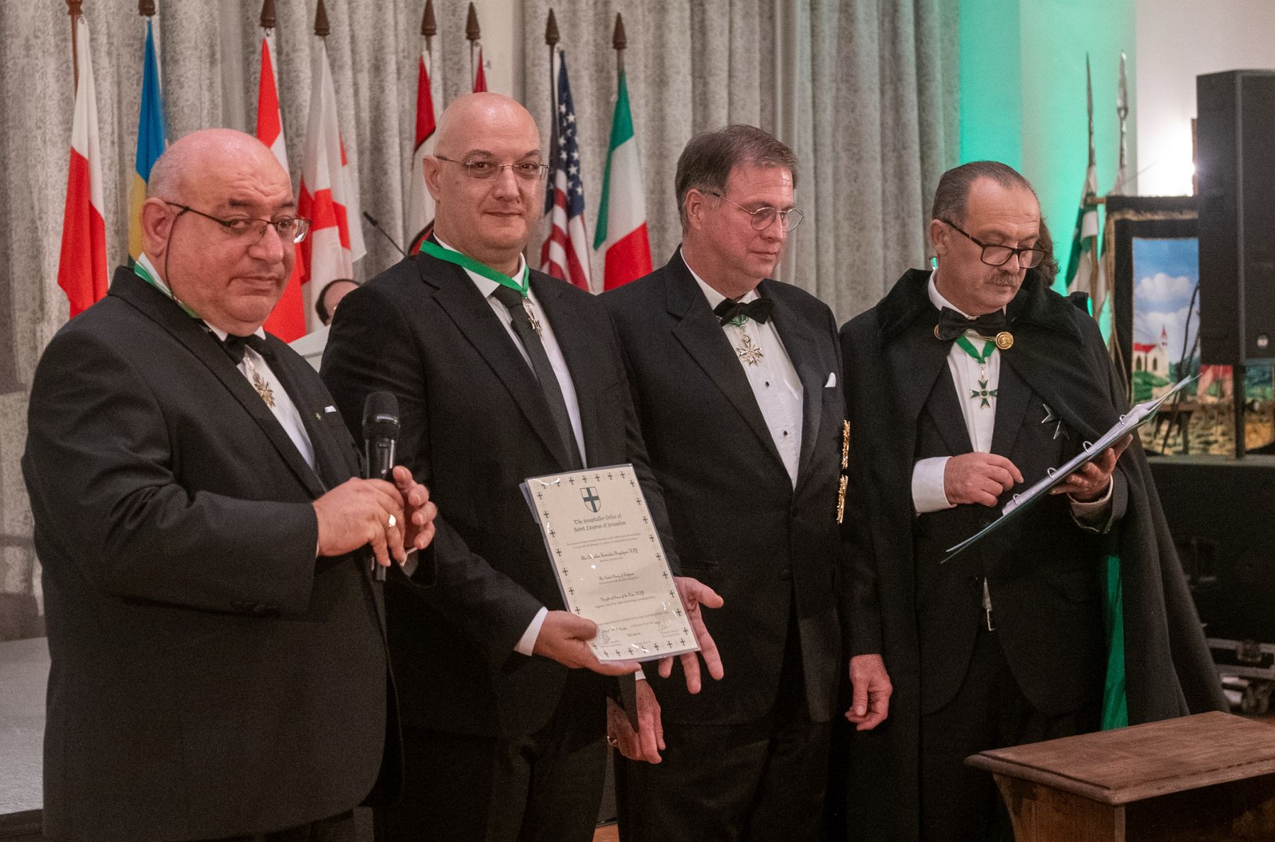 Chevalier Svetoslav Boyadzhiev with his certificate, beside the Grand Chancellor, H.E. Massimo J. Ellul, and the Supreme Grand Prior, HIRH Archduke Sandor Habsburg-Lothringen.