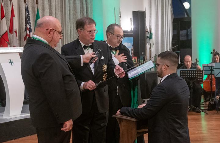 Chevalier Veselin Stankov receives the accolade.