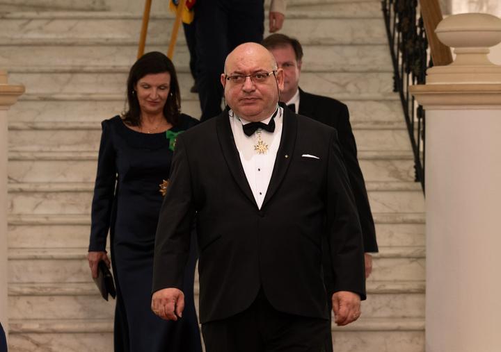 The procession of the investing officers, led by the Grand Chancellor.