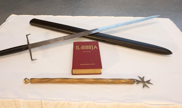 The sword, the Bible and the baton of the ceremony.