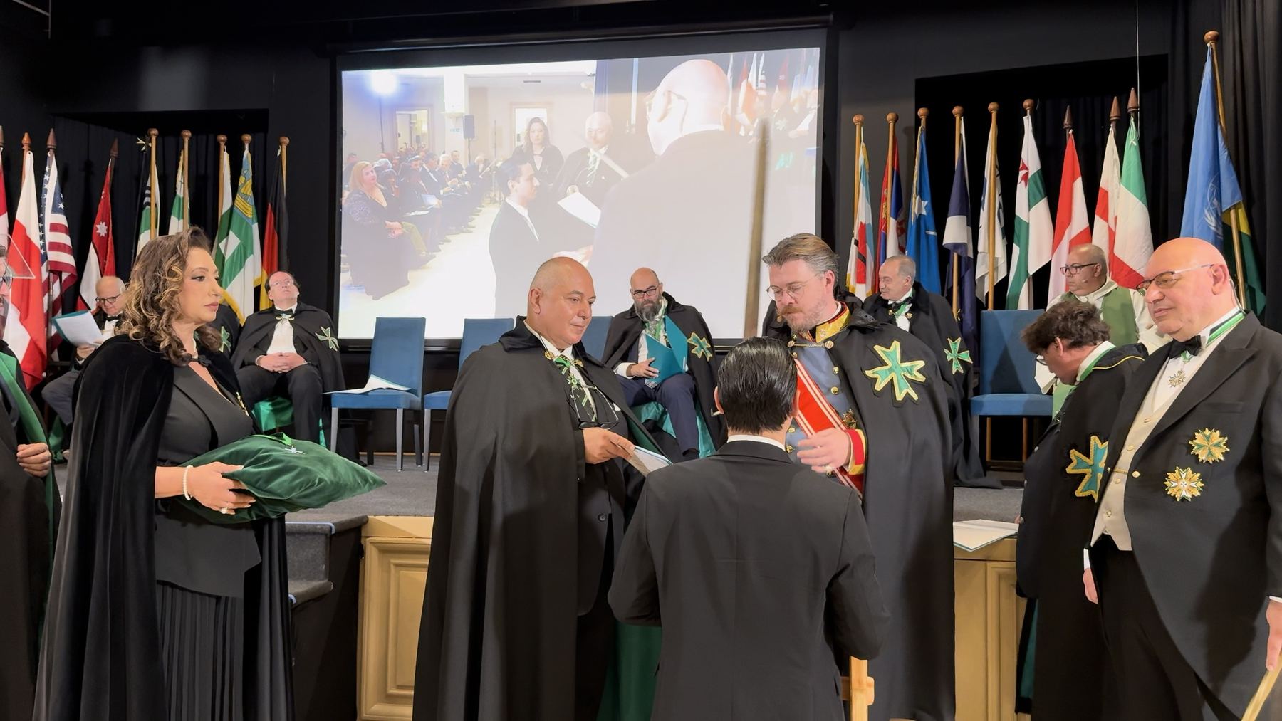 Chevalier Asen Margaritov receives the accolade from the Grand Vicar General in the presence of the Grand Chancellor.
